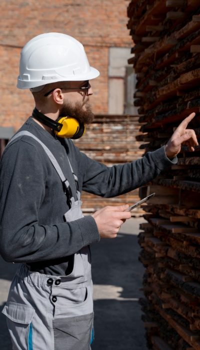 man-working-mdf-boards-warehouse